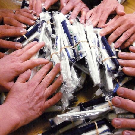 Packing hygiene kits for Gateway People Making Progress volunteers package over 30,000 daily hygiene kits a year for homeless men at Gateway Center to get cleaned up.