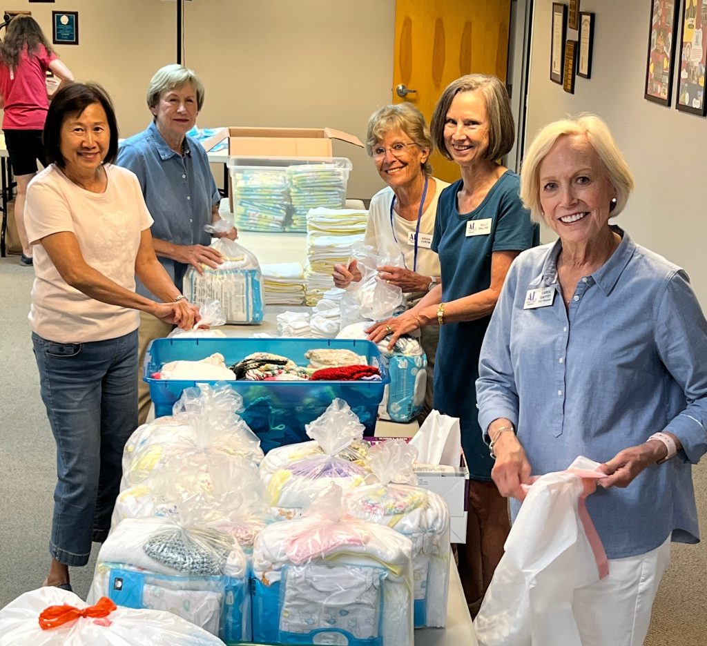 Members Pack Layettes for Mothers in Need