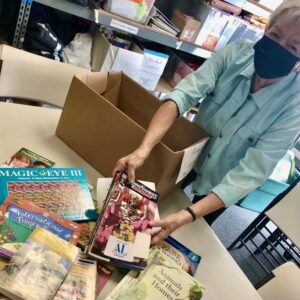 ALB volunteer sorts books