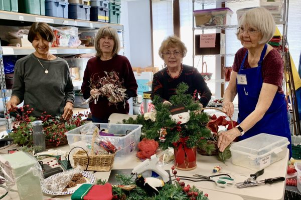 Assistance League members preparing Christmas decorations