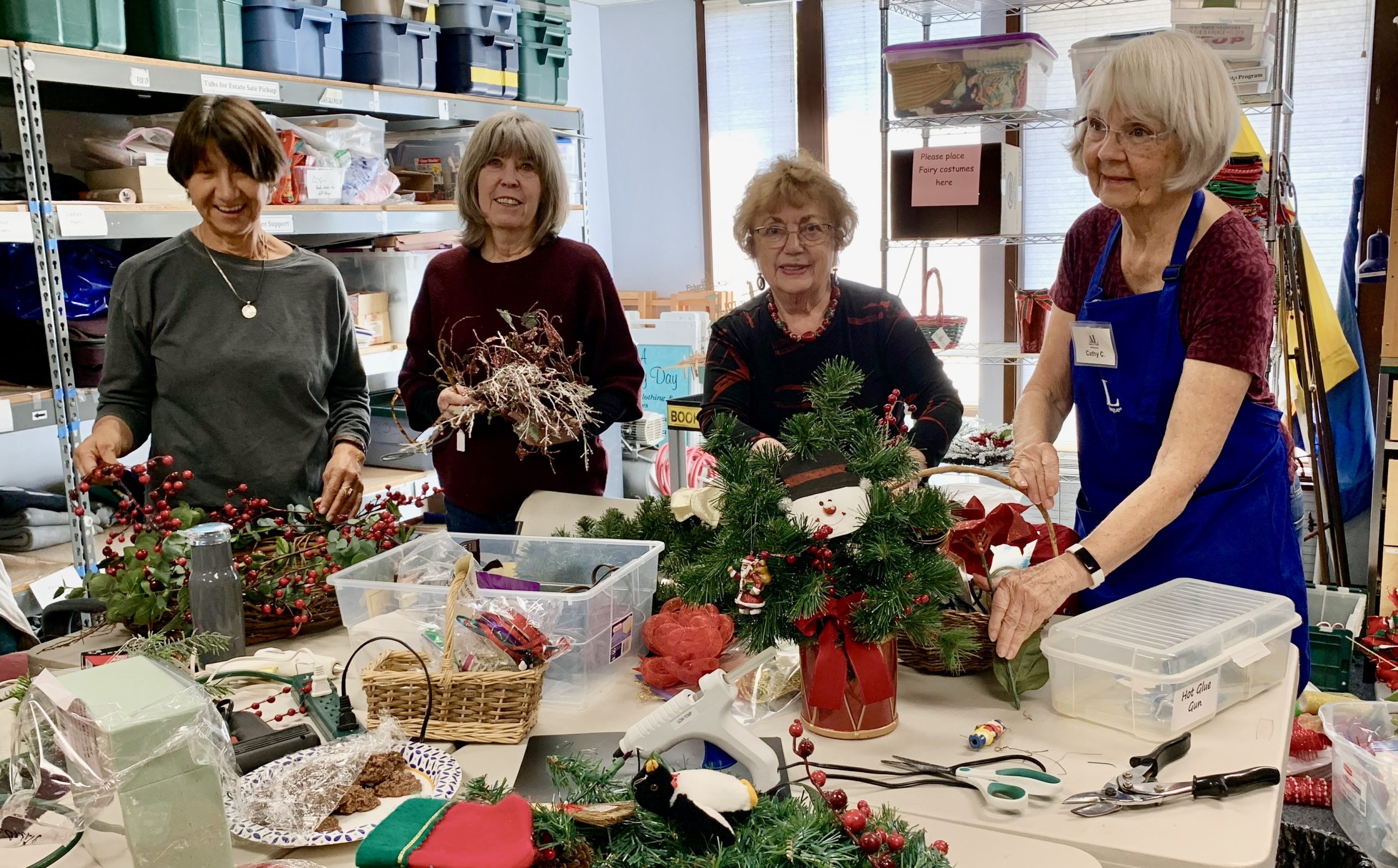 Assistance League members preparing Christmas decorations