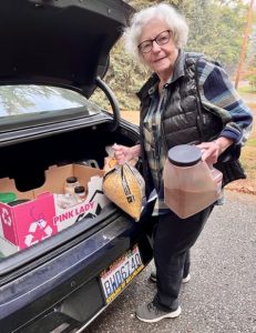 taking leftover food supplies to Maple Alley Inn