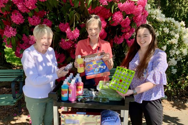 St. Francis Activity Director receives "Spring" gifts from member of the Care Center Support committee.