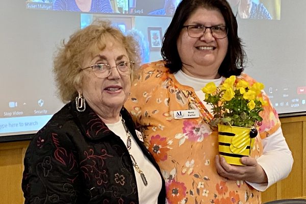 Jo Anne Lowe presents Busy Bee Award to Roxy Parise