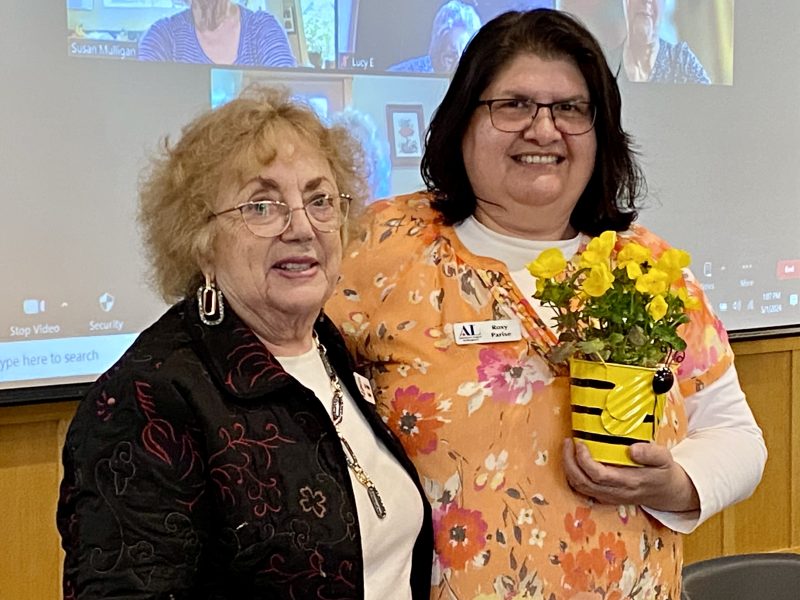 Jo Anne Lowe presents Busy Bee Award to Roxy Parise