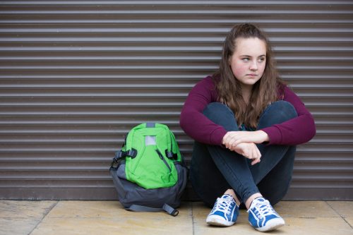 Homeless teen with backpack