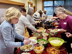 IMG_0005 members enjoying potluck lunch at regular meeting