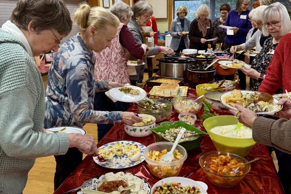 Assistance League members enjoy potluck lunch