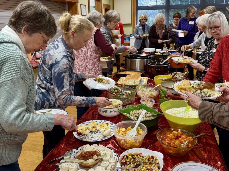Assistance League members enjoy potluck lunch