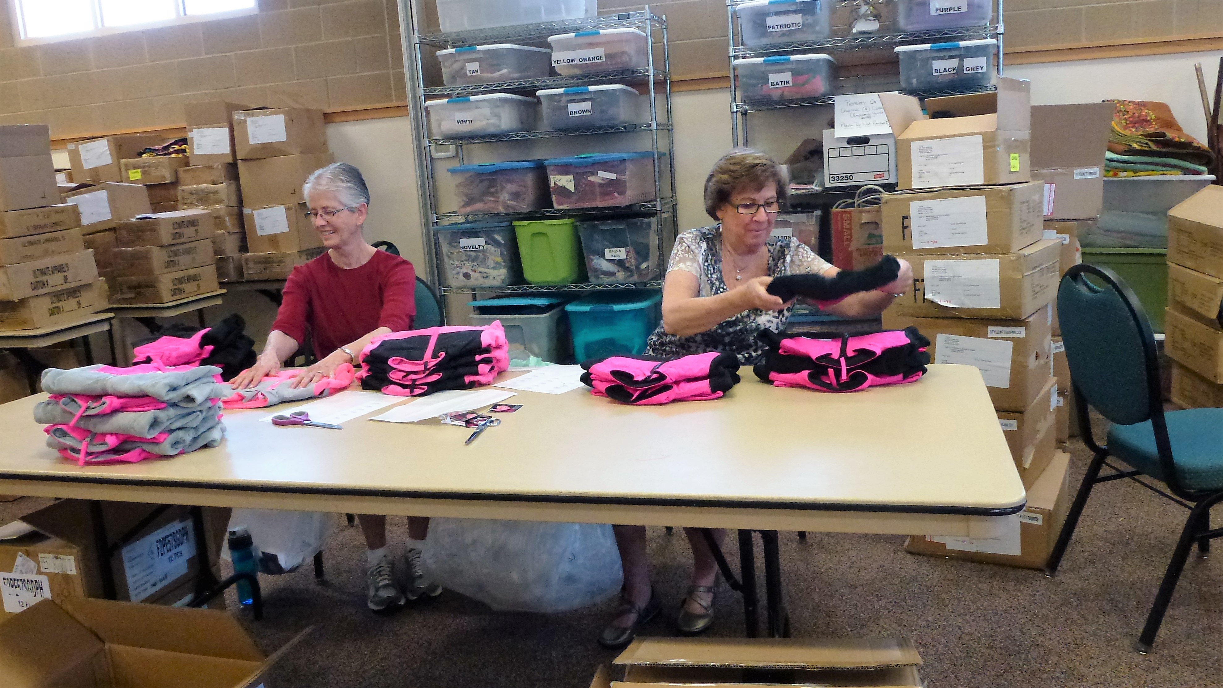 Members tagging sweatshirts for Operation School Bell