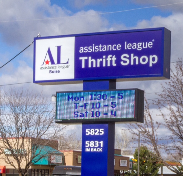 Thrift Shop sign displaying shop hours