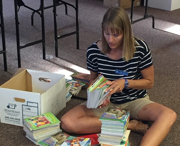 SPARK member preparing books for Operation School Bell