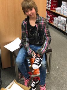 CC OSB 484x645 Girl shoe shopping at Canyon County Branch's first Operation School Bell event.