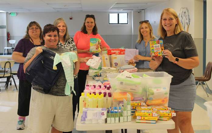 Canyon County Branch members assembling Baby Bundles