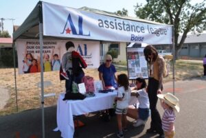 A family visiting our booth in Experience Garden City