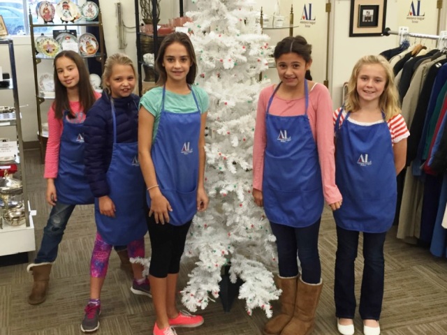 Children volunteering in our thrift shop back room