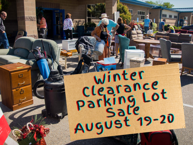 Goods in parking lot advertising winter clearance parking lot sale