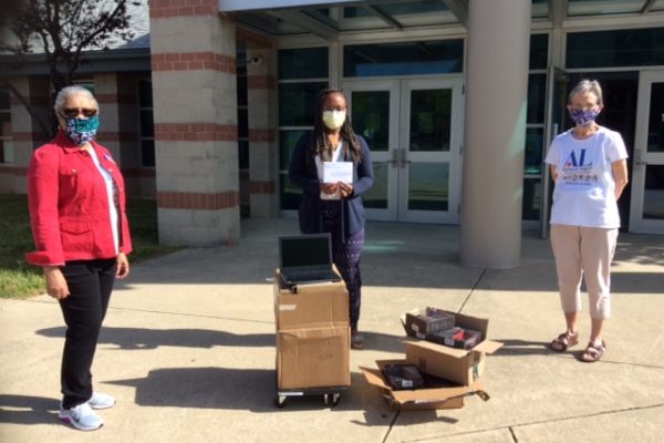 Assistance League members deliver Chromebooks to elementary schools