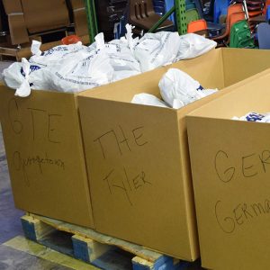 Uniforms for in-need students are packaged for each school.