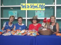 Volunteers serve refreshments at Back to School Night