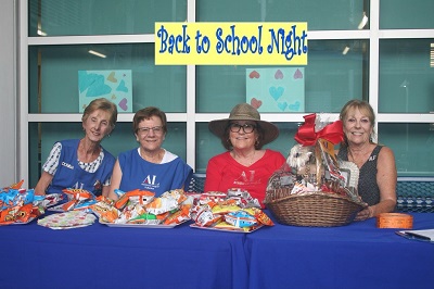 Volunteers serve refreshments at Back to School Night
