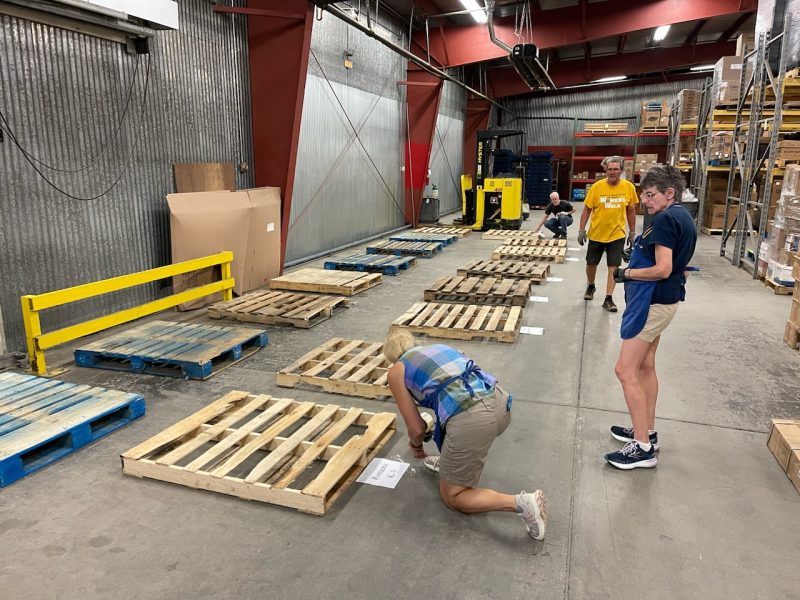 Preparing the pallets for each school Assistance League Greeley
