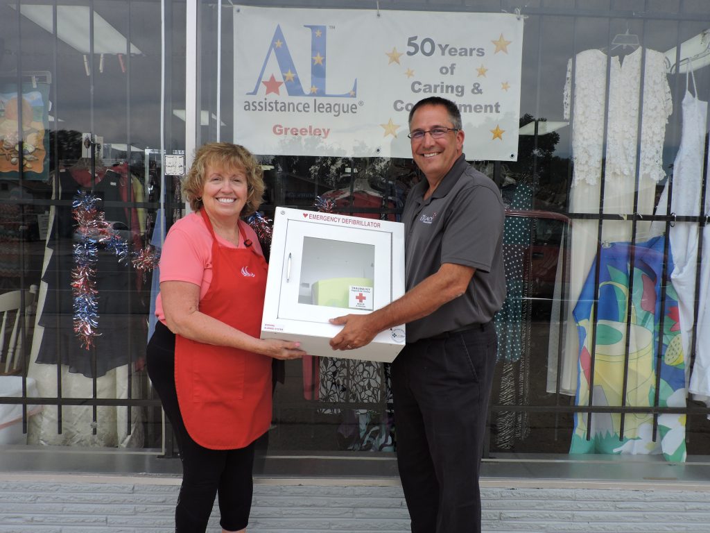 Bargain Box receives portable AED from Weld Legacy Trust