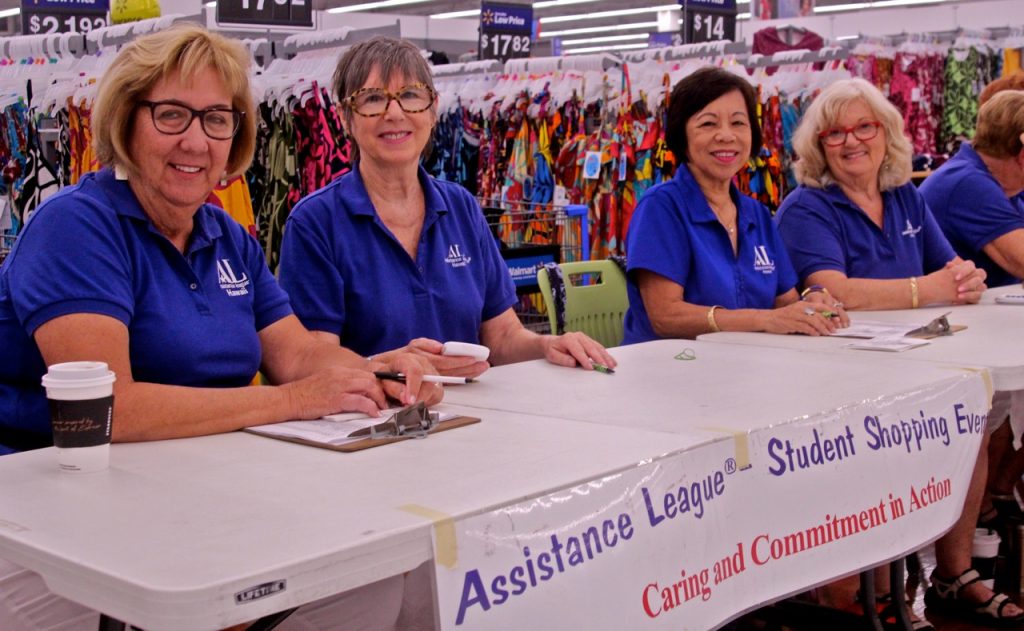 Assistance League Member Volunteers at Processing Table