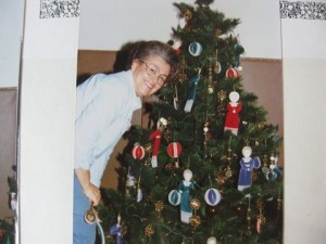 Pat Brudin and one of the many decorated trees at the Gala.