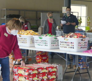 People and food bins at Weekend Food for Kids event