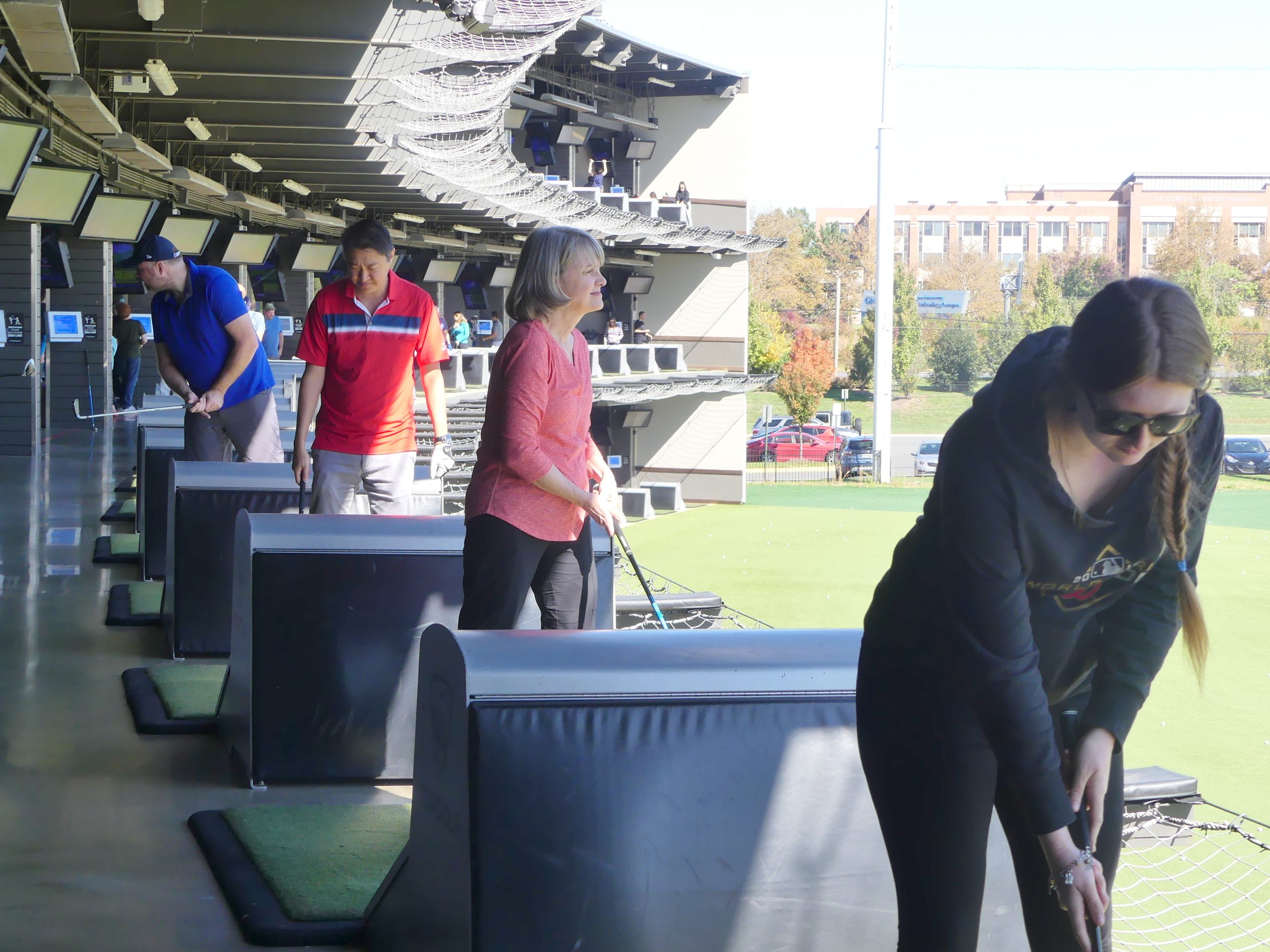 Various ALNV members and their guests take swings at the Swing Fore our Kids event