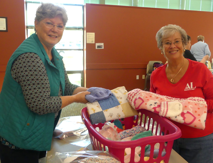 ALNV members show a few of the sample blankets that will be packed