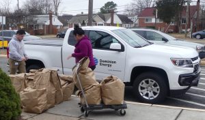 Bags being loaded up into a Dominion Energy truck to be delivered to families in need.