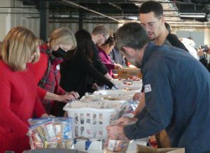 Dominion Energy and ALNV volunteers on a food packing line