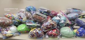 A collection of prepared bags of beanie babies and hygiene supplies for local NOVA children