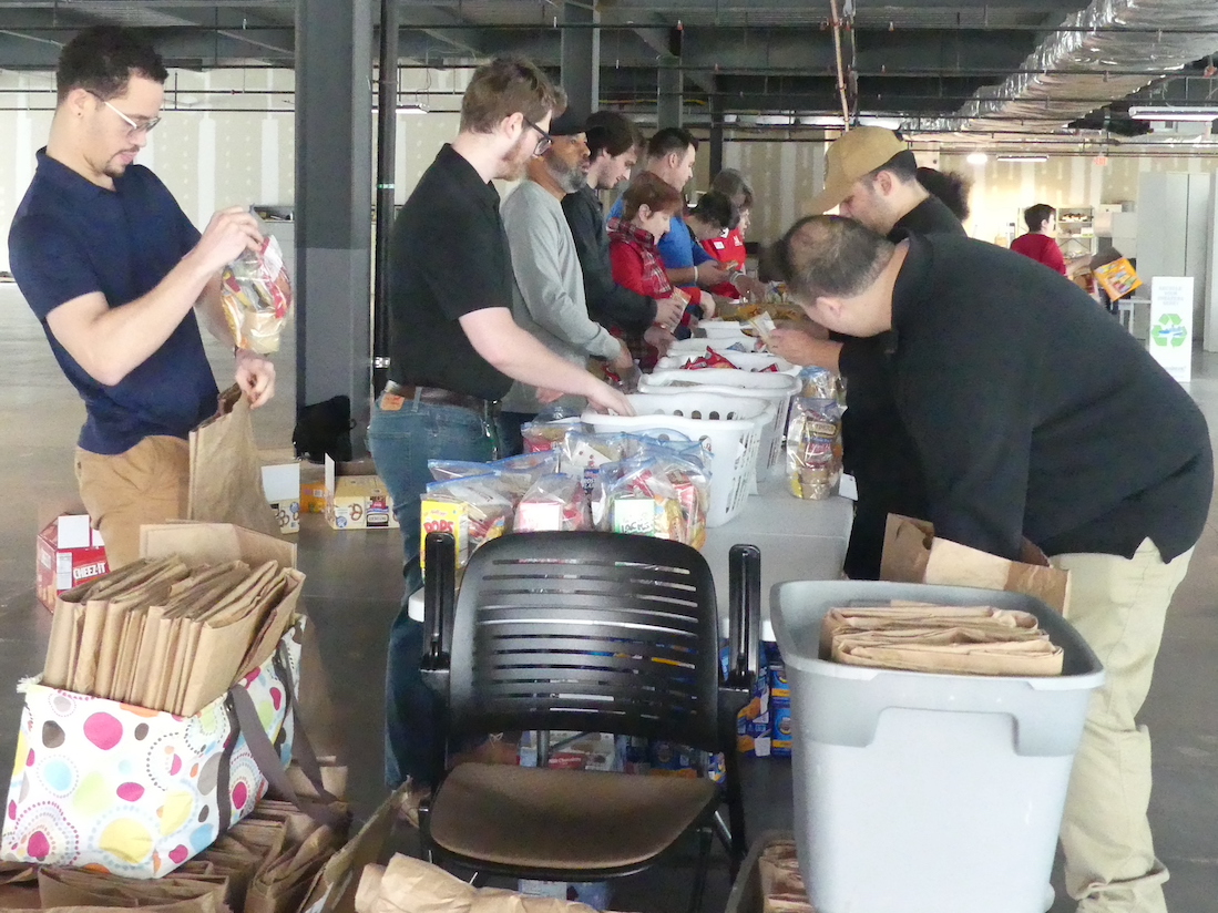 The start of an assembly line for the Weekend Food for Kids event