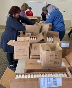 ALNV members unpacking boxes of supplies