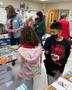 Kids view the the collection of new books