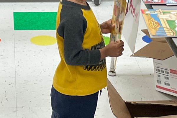 A child holds his new book