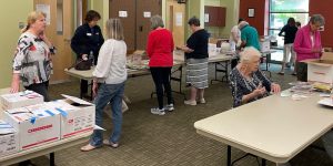 ALNV members packing the boxes of books to be delivered to local schools to support their reading programs
