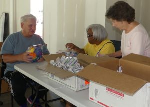 ALNV members discuss the packaging for the Bedtime Hugs mail boxes