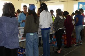 ALNV members and volunteers from other organizations on a food-packing line
