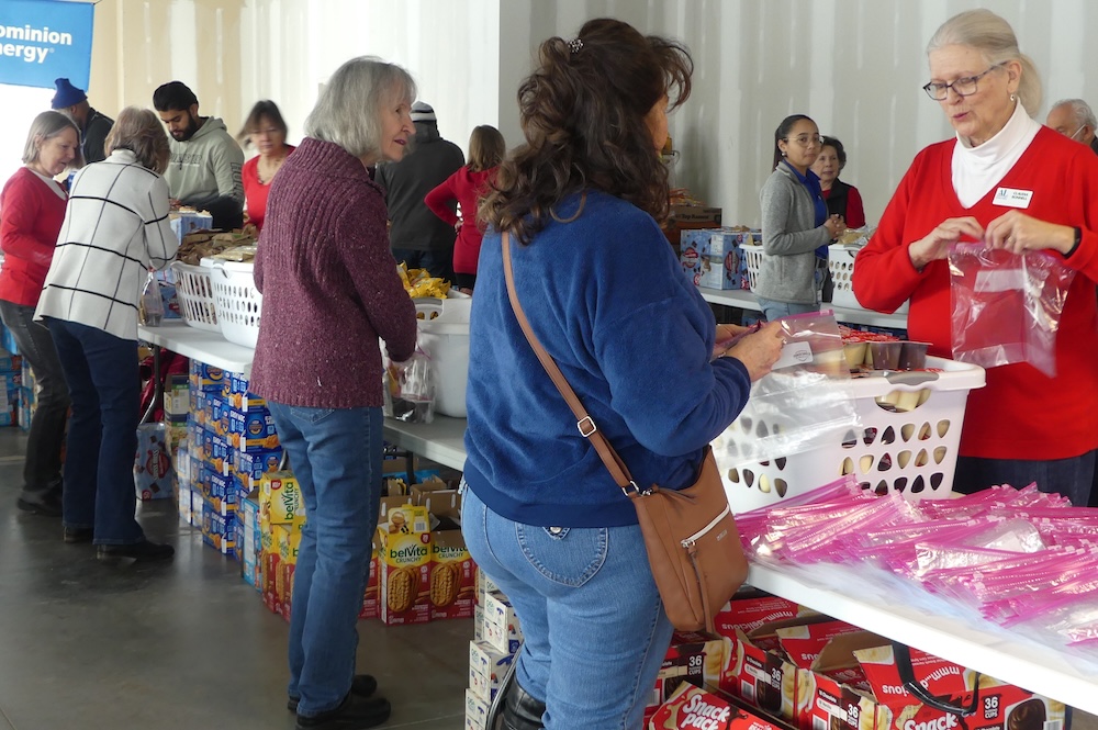 ALNV members and volunteers assembling clothing packages