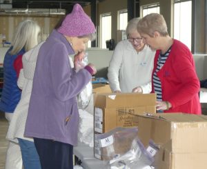 ALNV members helping pack toiletries.