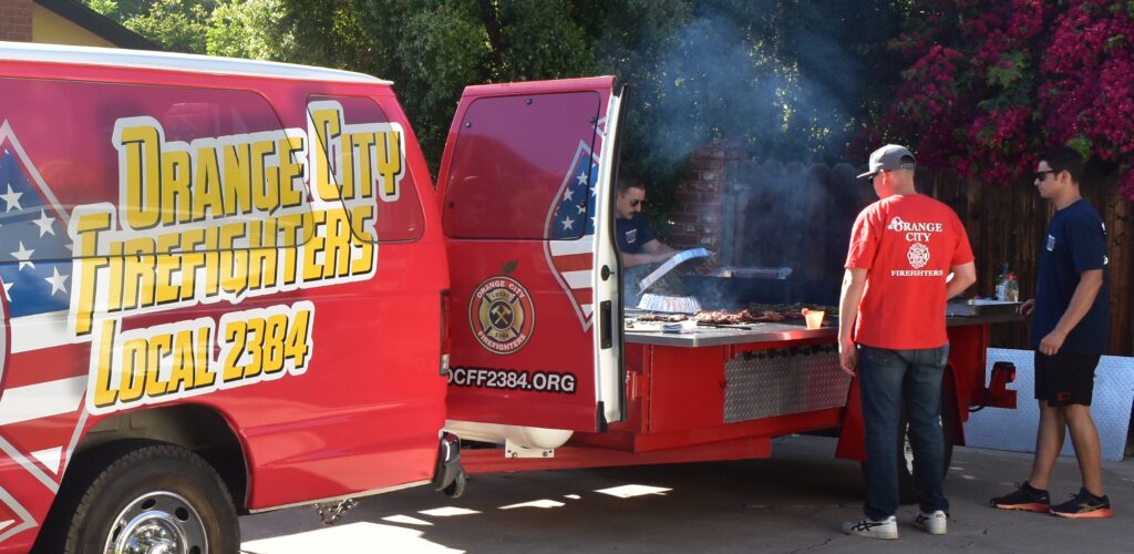 Orange City Firefighters Grill in Partnership with Assistance League