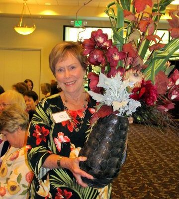 Volunteer with Vase of Flowers designed by Kren Rasmussen of Bloomsters
