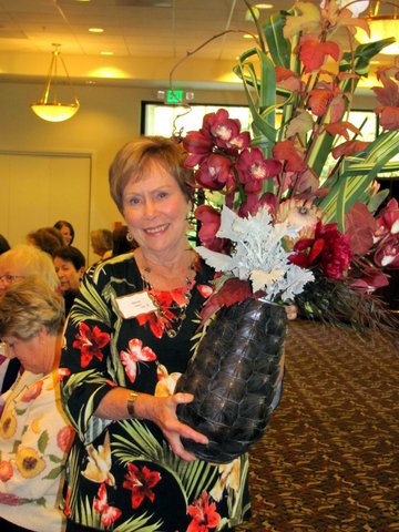 Volunteer with Vase of Flowers designed by Kren Rasmussen of Bloomsters