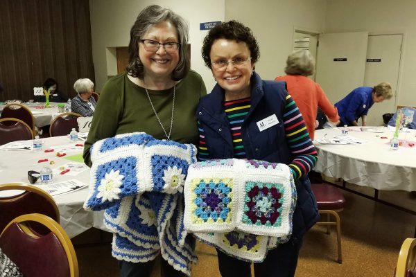 Members with crocheted afghans