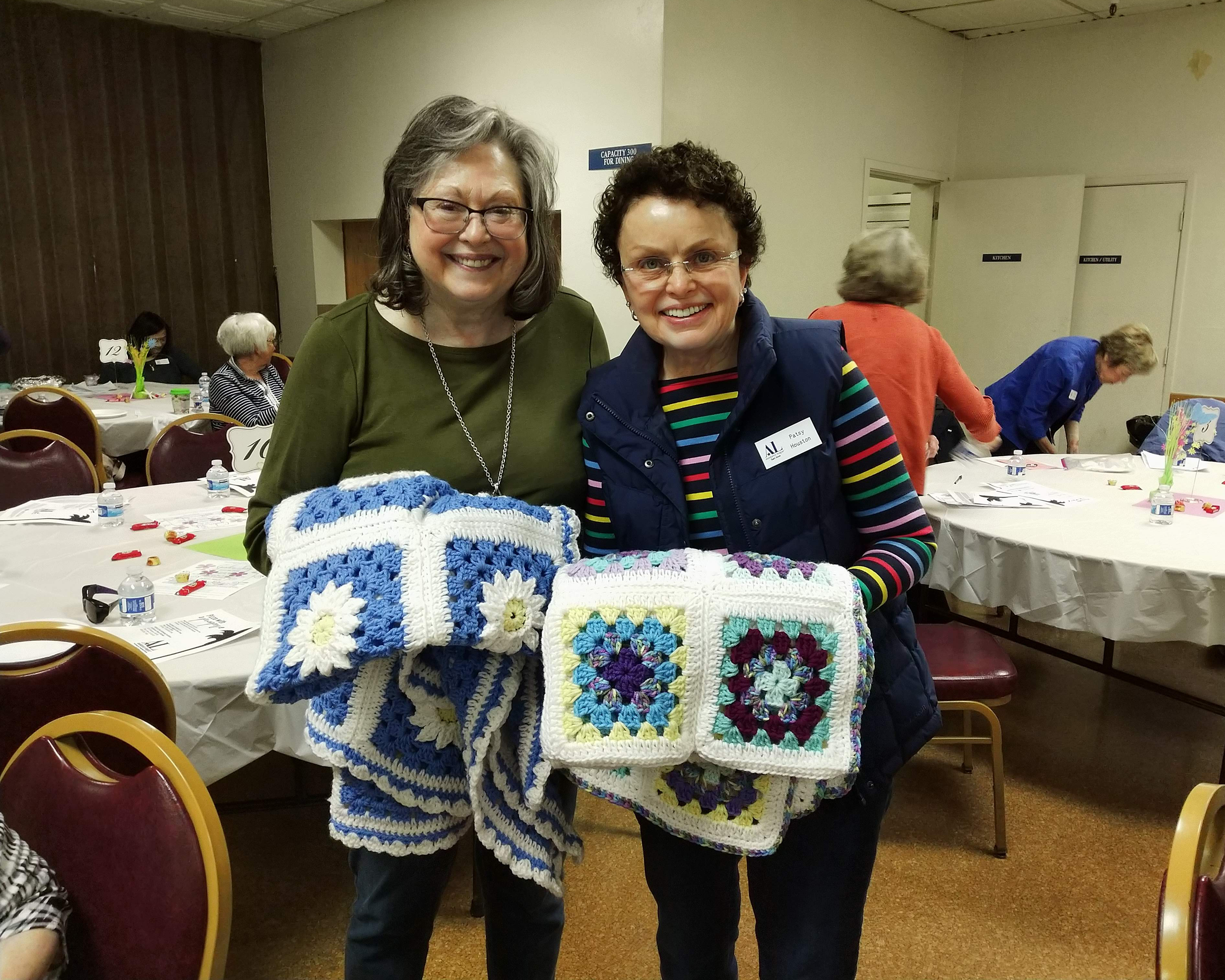 Members with crocheted afghans