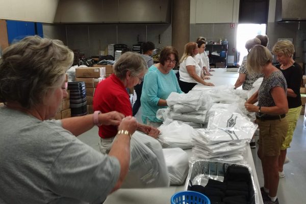 Sorting and bagging uniforms for OSB